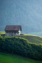 Alps house in mountains. Mountain green field alpine Mountains landscape nature with wooden old houses. Travel and Royalty Free Stock Photo