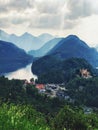 Alps and lakes in a summer day in Germany. Taken from the hill next to Neuschwanstein castle. View of the Royalty Free Stock Photo