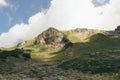 Alps mountain meadow tranquil summer view. Mountain valley village landscape summer. Mountain village view. Village in mountains.