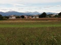 Alps and mountains in farmlands landscape in italy