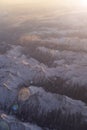 The alps mountains and fog, from an airplane.at dawn.in monochrome color