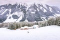 Alps, ski slope winter mountain landscape, house Royalty Free Stock Photo