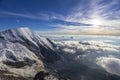 Alps snow mountain ridge above the clouds Royalty Free Stock Photo