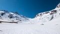 The Alps in springtime, sunny day snowy landscape ski resort, high mountain peaks in the alpine arch, avalanche danger. Royalty Free Stock Photo