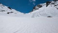 The Alps in springtime, sunny day snowy landscape ski resort, high mountain peaks in the alpine arch, avalanche danger. Royalty Free Stock Photo