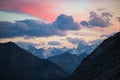 The Alps at sunrise. Colorful sky majestic peaks, dramatic valleys, rocky mountains. Expansive view from above. Royalty Free Stock Photo
