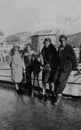 ALPS, SWITZERLAND, 1932 - Four holiday girls smile against the backdrop of the Swiss Alps