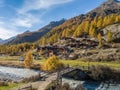 Alps village with tradtional wooden chalets in autumn