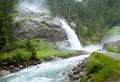 Alps waterfall summer view Royalty Free Stock Photo