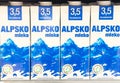 Alpsko mleko cartons with 3.5% fat content on store shelf Royalty Free Stock Photo