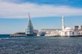 Alrahmah floating mosque with modern building and port and sea in foreground, Jeddah, Saudi Arabia