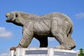 A Carved Wooden Bear on top of a multi-use monument, Alrewas.