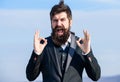 Alright gesturing. Man bearded optimistic businessman wear formal suit sky background. Success and luck. Optimistic mood Royalty Free Stock Photo