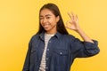 Alright, I agree! Portrait of cheerful smiling girl in denim shirt showing ok hand gesture, approval cool symbol