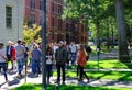 Students of prestigious Harvard University, MA, seen walking between lectures. Royalty Free Stock Photo