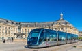 Alstom Citadis 302 tram at Place de la Bourse station in Bordeaux, France. Bordeaux tram system has 66 km of lines and Royalty Free Stock Photo