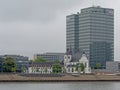 Alt Saint Heribert church, and modern office building in Cologne