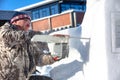 Alta, Finnmark, Norway - March 7, 2019: Preparation for the city exhibition of ice and snow sculptures. The master makes a