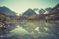 Altai forest reflect on the lake. beautiful landscape in morning time with warm tone. Beautiful calm landscape in the mountains Royalty Free Stock Photo