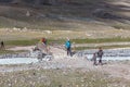 Altai, Mongolia - June 14, 2019: Mongolian children show tourists local attractions