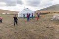 Altai, Mongolia - June 14, 2017: A small settlement of the nomadic people of Mongolia. Children play outside. Throwing ground at