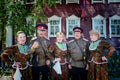 Altai, Russia-July 24, 2018.two Cossacks in military uniform sing a song with their wives