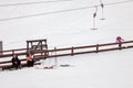 A woman and boy skier slides down the mountain over white snow in a sports tourist base Turquoise Katun. Seasonal sports