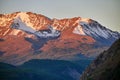 Altai, Snow-capped mountains at sunset. The evening sun shines on the mountains, autumn landscape Altay. Noise and blur Royalty Free Stock Photo