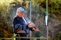 Shooter from a gun practicing shooting on plates in nature Royalty Free Stock Photo