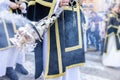 Altar boy or acolyte in the holy week procession shaking a censer to produce smoke and fragrance of incense