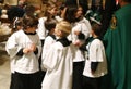 Altar boys inside the church before the start of an easter holy week procession in mallorca