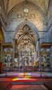Altar and chapels inside the medieval church of San Francisco, part of the Chapel of Bones. Altar with saints and crucified Jesus Royalty Free Stock Photo