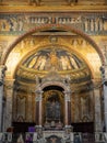 Altar decoration with golden mosaics inside roman catholic church