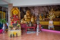 Altar with golden laughing cheerful fat Buddha and Ganesha. Royalty Free Stock Photo