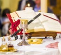 Altar with missal and host which becomes the body of Christ and chalice to receive the wine, the blood of Christ Royalty Free Stock Photo