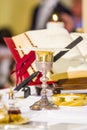 Altar with missal and host which becomes the body of Christ and chalice to receive the wine, the blood of Christ Royalty Free Stock Photo
