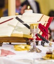 Altar with missal and host which becomes the body of Christ and chalice to receive the wine, the blood of Christ Royalty Free Stock Photo