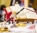 Altar with missal and host which becomes the body of Christ and chalice to receive the wine, the blood of Christ Royalty Free Stock Photo