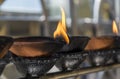 Altar with small burning wooden cups