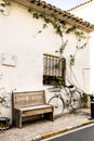 Bicycle resting on the typical whitewashed facade of a house in Altea