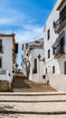 Altea old town, Spain. Beautiful village with cobblestoned narrow step street, typical Mediterranean white houses and Royalty Free Stock Photo