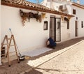 Altea, Spain, 02,06,2020:Painter man, painting the restaurant wall