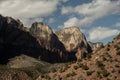 Alter Of Sacrifice And Meridian Tower With Puffy Clouds Passing Over Head In Zion