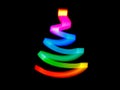 Alternative Christmas tree in colorful neon freezelight rays on black. Creative pattern with copy space for text and