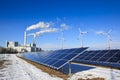 Alternative energy - rack of brand new solar panels and thermal power plant Royalty Free Stock Photo