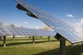 Alternative energy - solar panel against blue sky mounted on a rack on a meadow Royalty Free Stock Photo