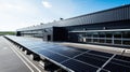 Alternative energy. Solar panels on the roof of a black industrial or RND building. autonomous power supply