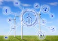 Alternative energy source. Wind turbines in field under sky and scheme Royalty Free Stock Photo