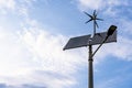 Alternative energy sources. Renewable photovoltaic technology with solar energy power panel and wind turbine. Sun energy Royalty Free Stock Photo