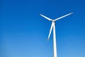 Alternative energy. Wind power turbine against a blue sky background. Renewable energy source Royalty Free Stock Photo